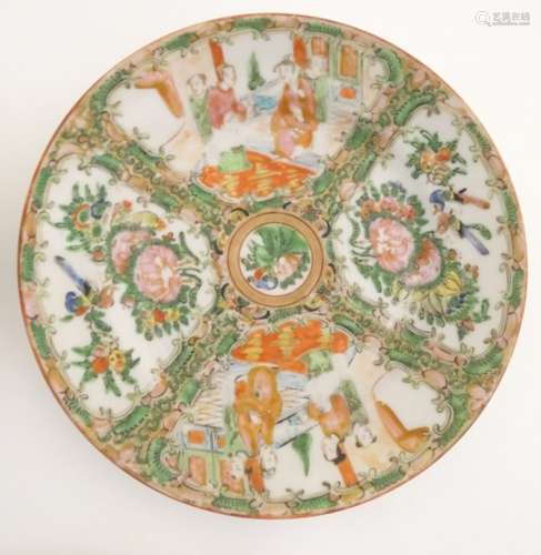 Five Cantonese plates with panelled decoration depicting figures in interior settings and birds