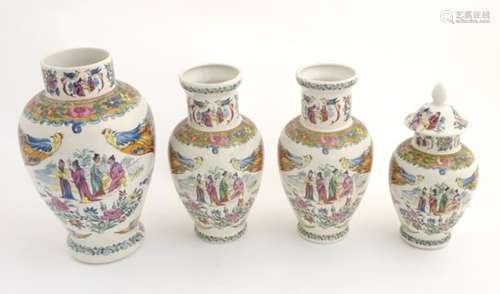 Four matching Japanese vases of various sizes, one lidded.