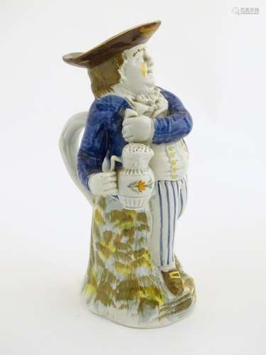 An early 19thC Prattware Toby jug depicting Hearty Good Fellow,