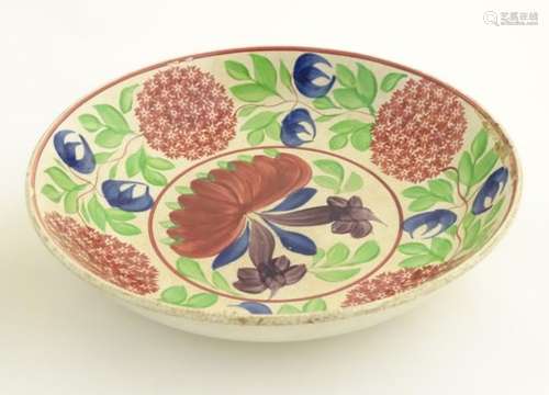 A pair of 19thC spongeware bowls decorated with a colourful,