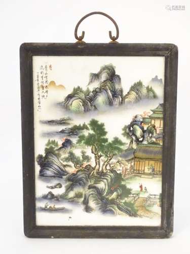 A Small Chinese ceramic screen in wooden surround, depicting figures,