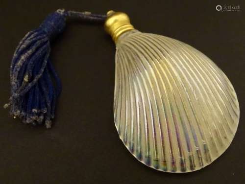 Glass shell scent bottle: an iridescent scallop shell scent bottle with turned brass screw lid,