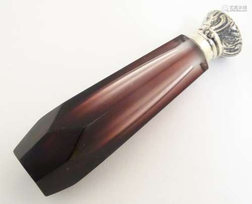 A 21stC amethyst glass scent/perfume bottle, fitted with a hinged white metal lid and collar.