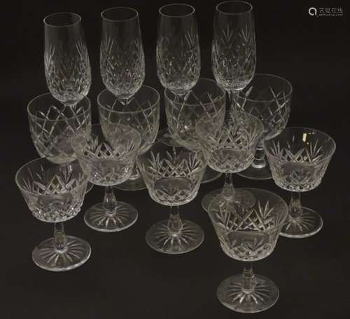 An assortment of crystal drinking glasses, comprising pedestal glasses (6),