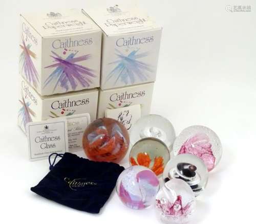 A collection of Caithness studio glass paperweights (four boxed), to include 'Starwatch',