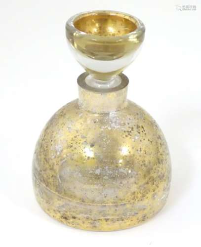 A 20thC squat formed scent bottle and stopper by LSA Poland, with burnished gold finish,