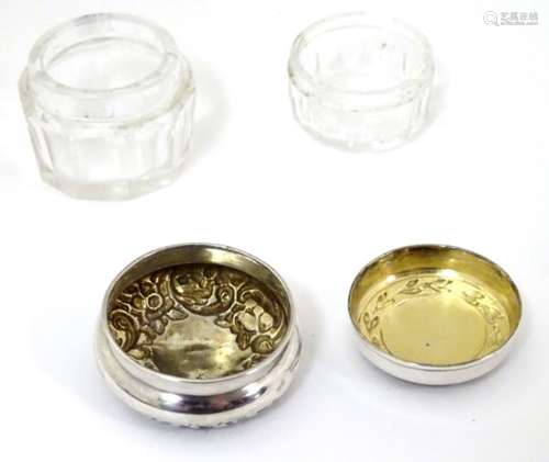 Two cut glass dressing table pots / jars with silver tops, one hallmarked Birmingham 1898 ,