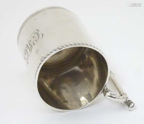 A silver Christening mug with ornate handle hallmarked Birmingham 1908 maker Jones & Crompton 3