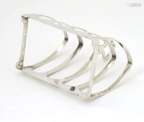 A silver 5 bar toast rack hallmarked Sheffield 1937 maker Viners Ltd.