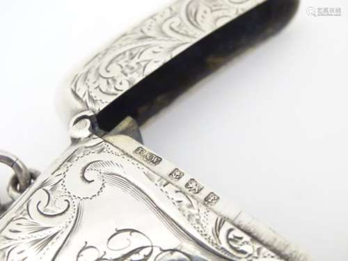 A silver vesta case with engraved decoration. Hallmarked Birmingham 1905 maker Reynolds & Westwood.