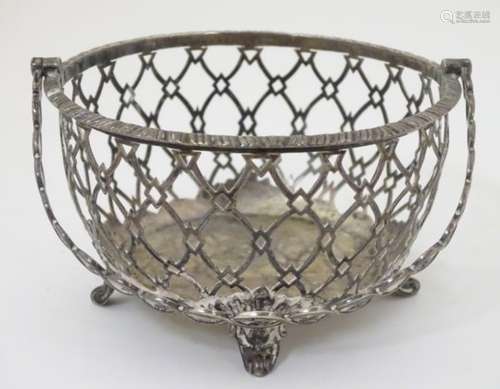 A silver basket / sucrier frame with singe over handle.