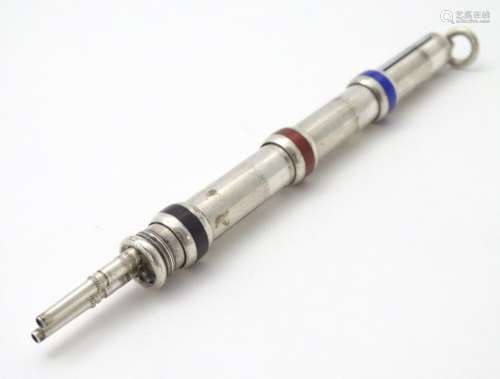 An unusual silver pencil , having provision for three different coloured leads,