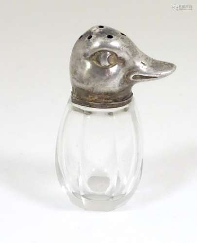 A novelty pepperette with glass body formed with silver top formed as a duck.