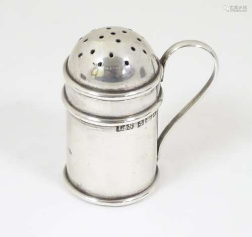 A silver pepperette formed as a flour shaker hallmarked Birmingham 1902 maker Levi & Salaman 1 3/4