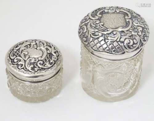 2 cut glass dressing table jars with silver tops one hallmarked Birmingham 1900 maker The Alexander