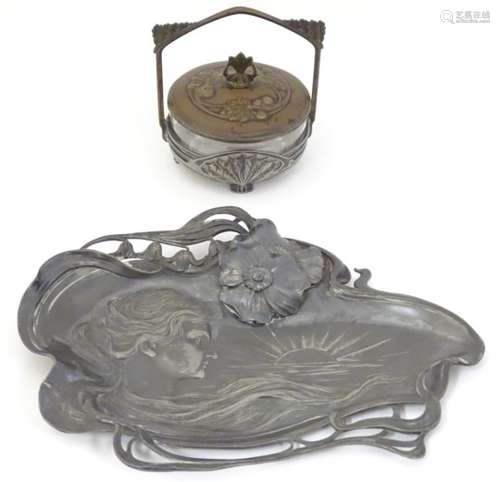 An early 20thC WMF Art Nouveau dish decorated in relief with the head of a Jugendstil style woman