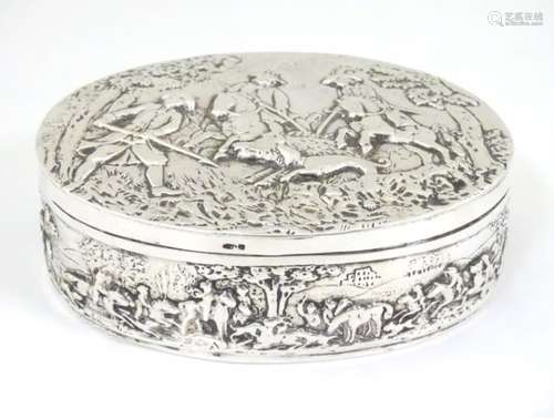 Continental silver table box of oval form profusely decorated with various Continental hunting