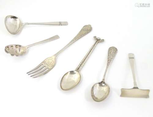 Assorted silver items comprising A picture back teaspoon with handle decorated with Neptune /