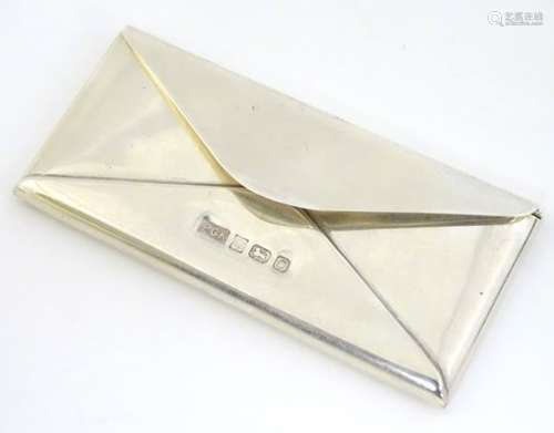 A novelty silver stamp case formed as an envelope hallmarked Birmingham 1988 maker Philip Kydd.