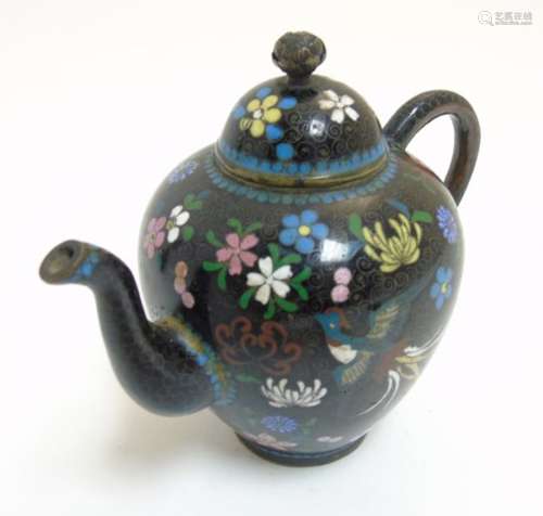 A 19thC small Oriental Cloisonne brass teapot with firebird and floral decoration.