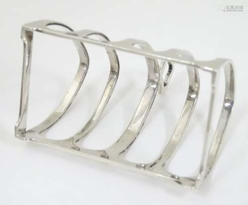 A 5 bar toast rack hallmarked Birmingham 1932 maker Elkington & Co.