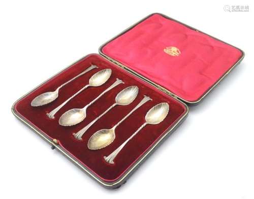 A cased set of Onslow pattern teaspoons with shell formed bows.