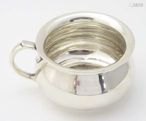 A silver punch cup hallmarked London 1938 maker Goldsmiths & Silversmiths Co.