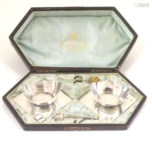 An unusual pair of silver plated salts mounted on squared bases,