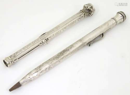 A Victorian white metal combination fountain pen and mechanical pencil with red stone seal to top