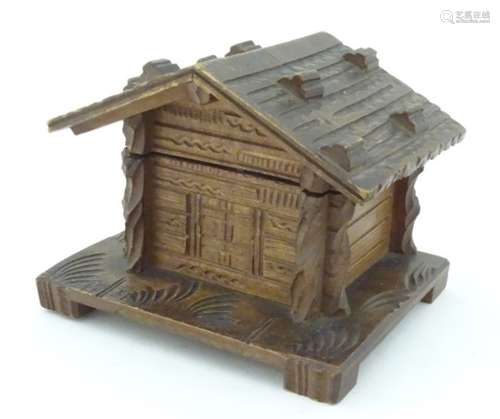 A carved wooden inkwell formed as a Swiss chalet. Approx. 3 1/2