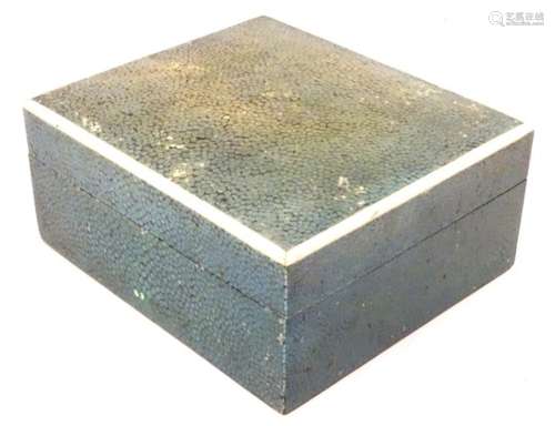 An early 20thC green shagreen box of rectangular form with wood lined interior and banding around