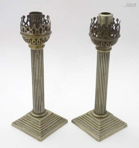 Two silver plate lamp bases / candlesticks of column form. Approx. 10