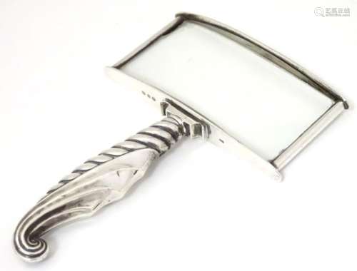 A Victorian reading glass / magnifying glass with silver surround hallmarked Birmingham 1899.