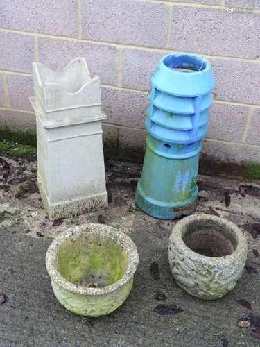 Two terracotta chimney pots together with a York stone planter and a composite planter.