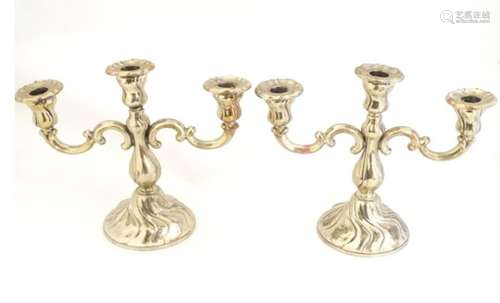 A pair of Continental silver candelabra marked .835 . Approx 9