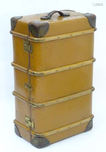 A 20thC 'BCM Orient' steamer / travelling trunk, of hardened canvas construction with leather trim,