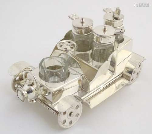 A 21stC silver plated novelty cruet set, formed as an early motor car.