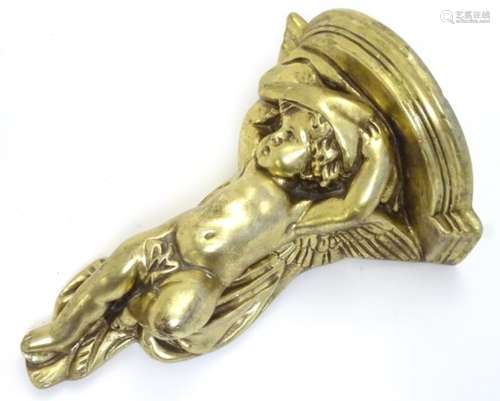 A gold painted wall bracket with Cupid / putti decoration. Approx.