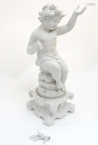 A 19thC German bisque figure of a seated Putti on a Rococo base and holding a palm in right hand,