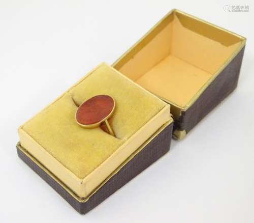 A 19thC French gold signet ring set with carnelian hardstone seal depicting a dove on a branch