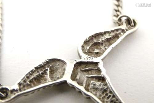 A silver pendant and chain, the pendant of abstract modernist form. Approx. 31” long.