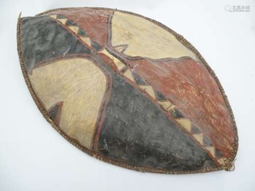 Ethnographic Native Tribal : A Native American almond shaped shield with painted hide construction