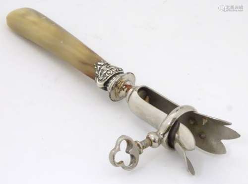 A late 19th / early 20thC French silver plate and horn manche a gigot (ham bone holder),