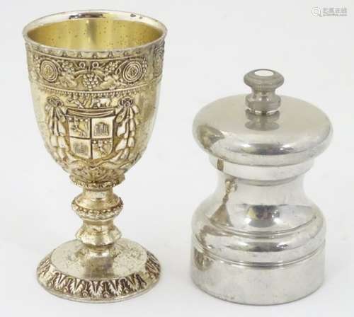 A 20thC pepper mill / grinder, together with a silver plate footed cup. Approx.