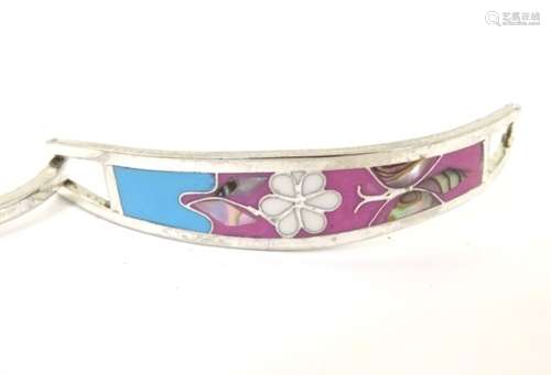 A Mexican silver bangle formed bracelet with butterfly and flower decoration and set with enamel