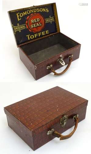 A hinged tin formed as a suitcase with all over crocodile print.