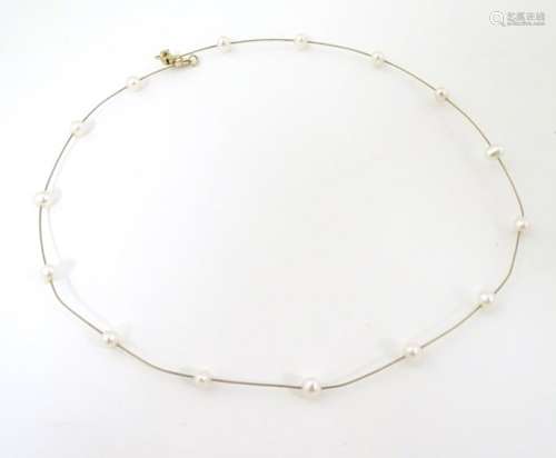 A 9ct gold necklace set with pearls, approx.