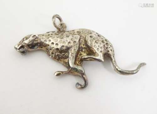 A silver pendant formed as a running cheetah,