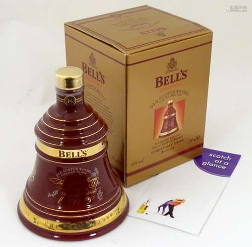 A boxed Wade porcelain decanter of Bell's 'extra special' old scotch whisky, Christmas 1999 edition,