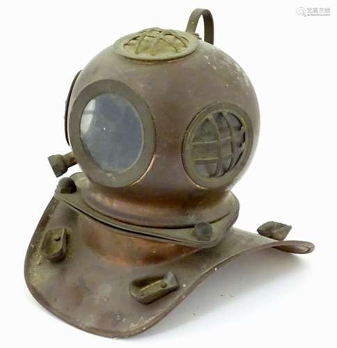 A small proportion model of a copper and brass diving helmet. Approx. 6 3/4